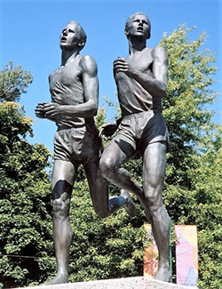 A statue, forever standing, showing Landy being beaten like a fool
